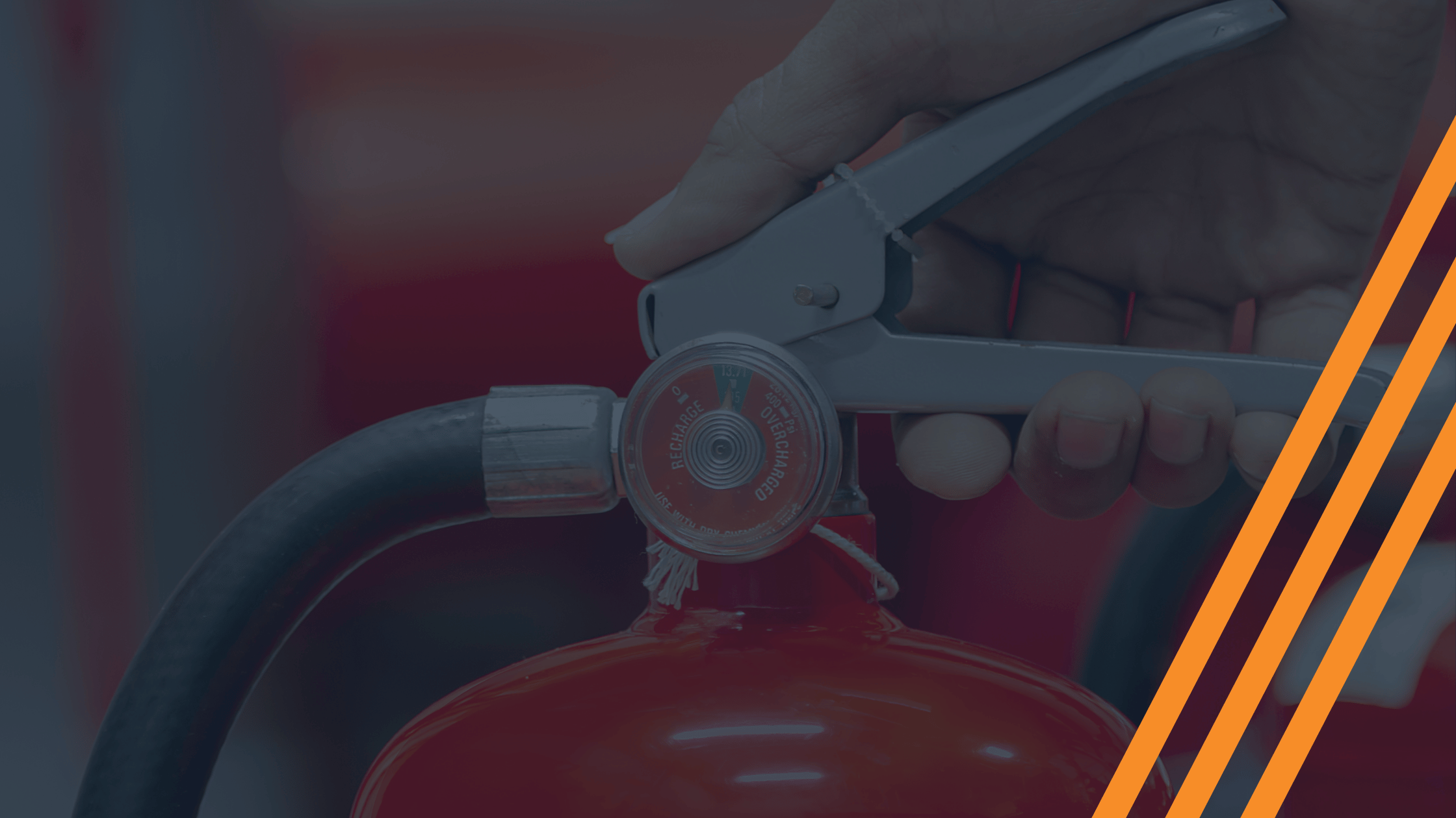 close up of hand holding a fire extinguisher.